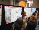 Claudia Rugama explains to first year Rutgers students about her summer research